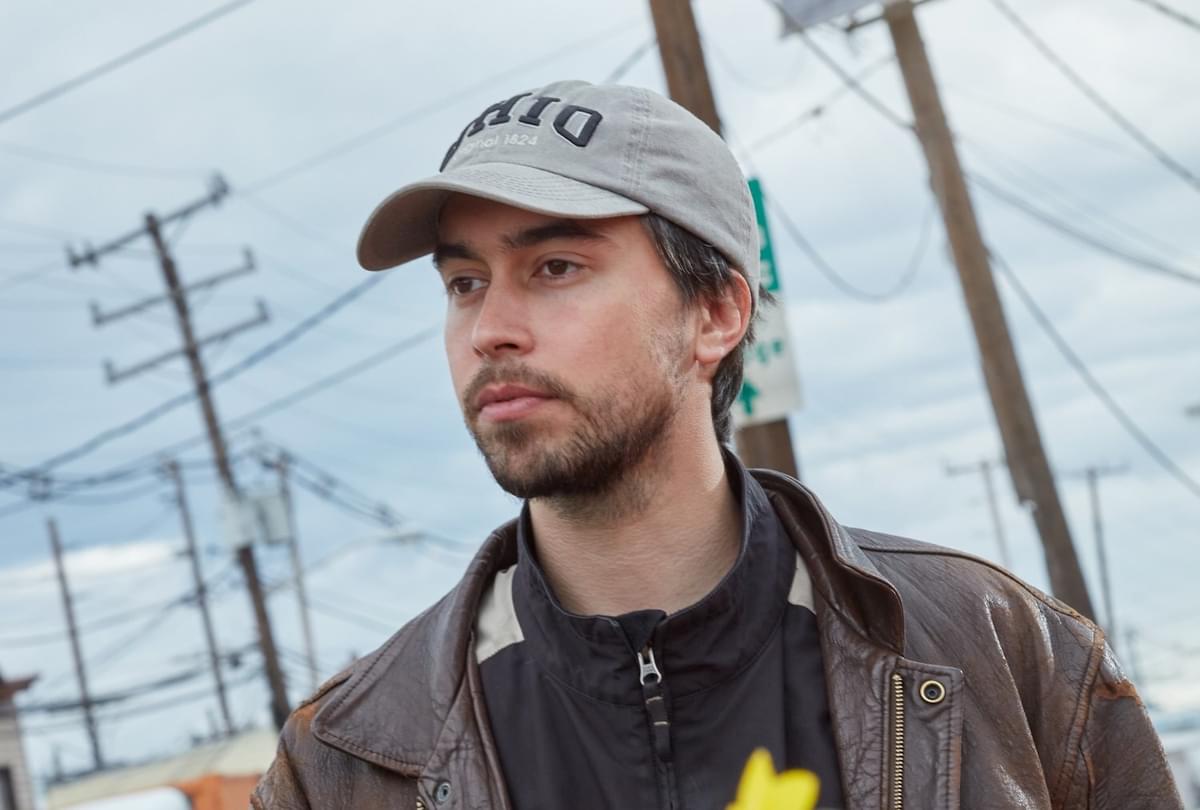 Alex G in a baseball cap and leather jacket for "Miracles" single