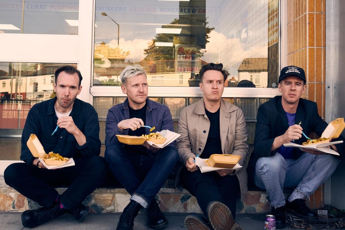 Dutch Uncles eating chips 2022
