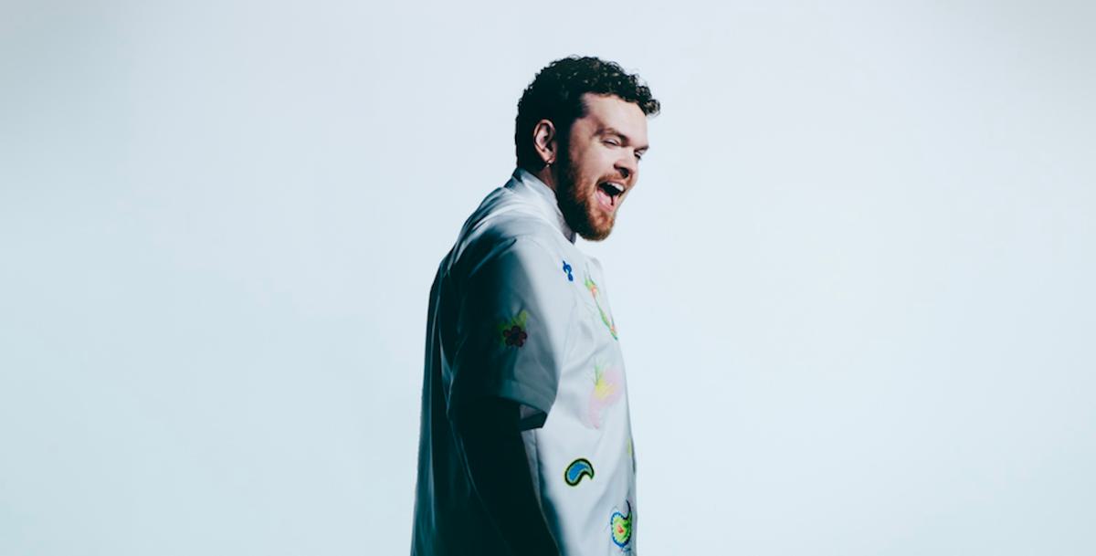 Jack Garratt smiling studio white backdrop