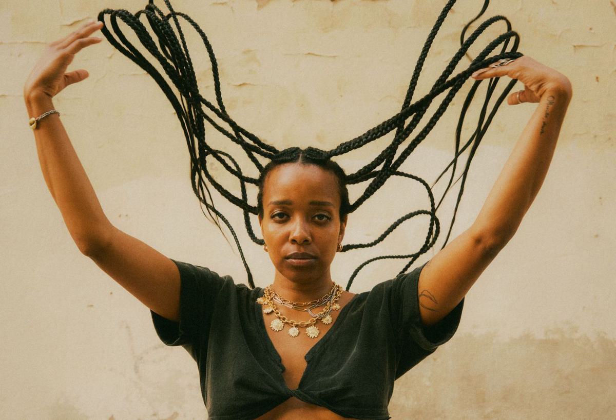 Jamila Woods hair flick for "Boundaries" single 2022