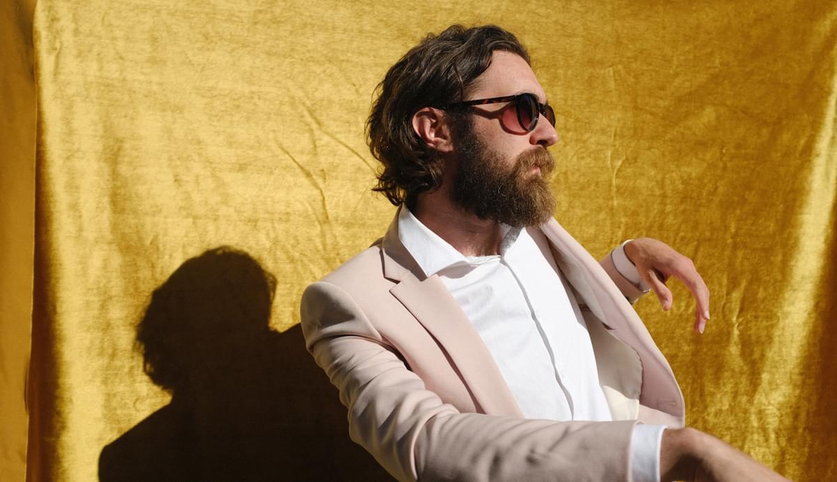Keaton Henson sunglasses yellow fabric backdrop 2023