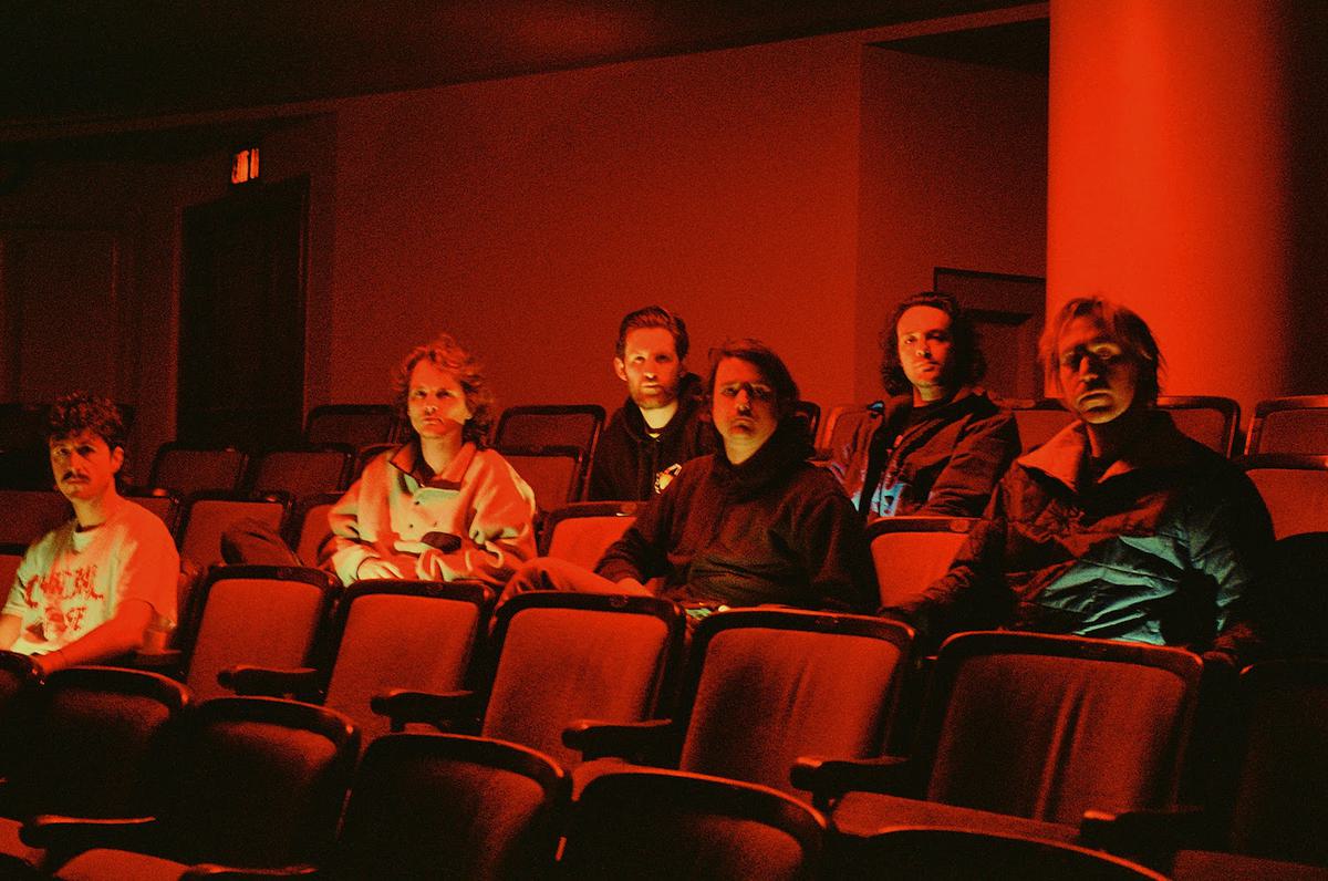 King Gizzard and the Lizard Wizard cinema seats red lighting