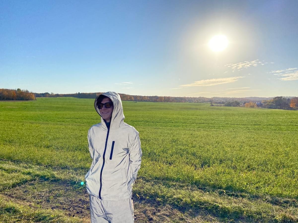 Leland Whitty reflective shell suit in field