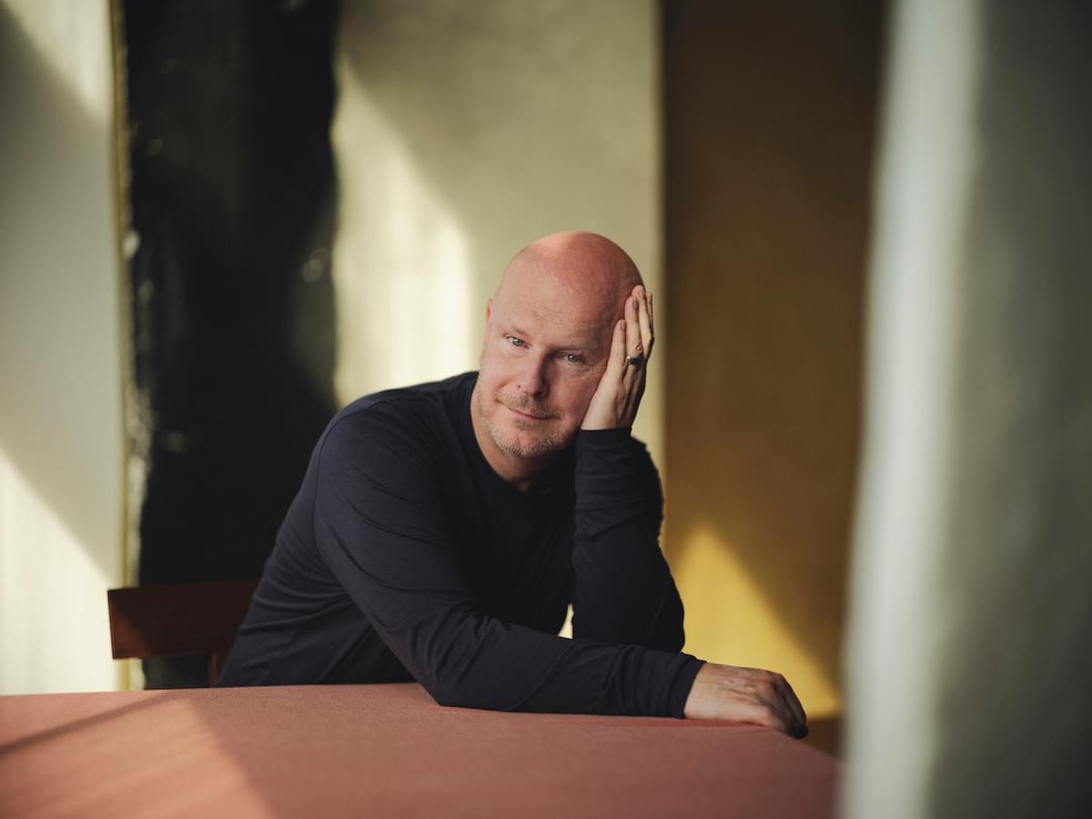 Philip Selway resting head on hand sat at table