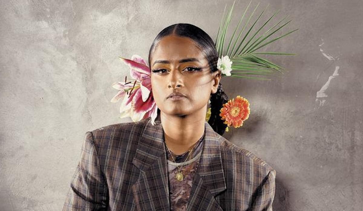 Priya Ragu checkered blazer with flowers in hair for "Adalam Va" single