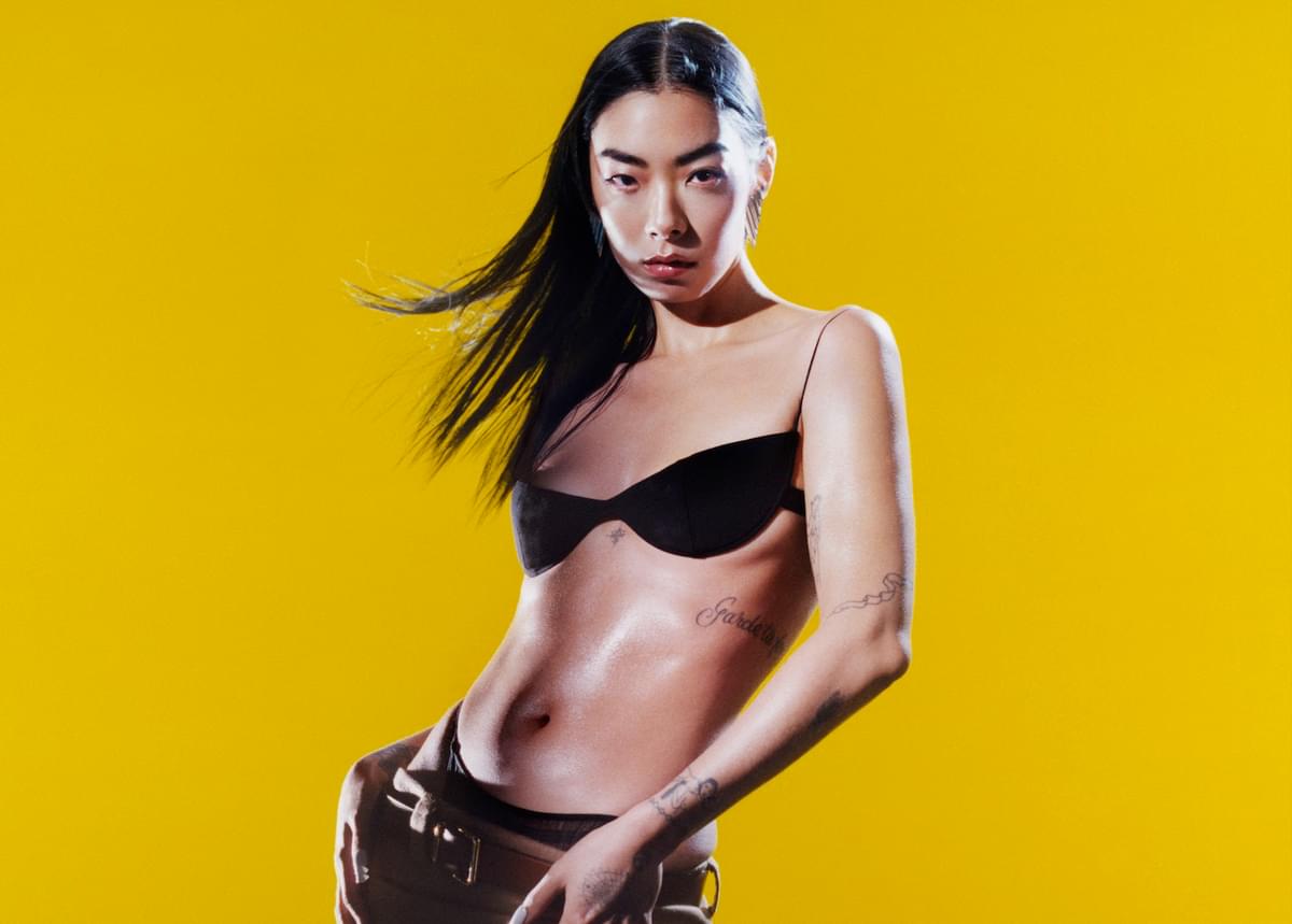 Rina Sawayama against yellow backdrop for "Hurricanes" single
