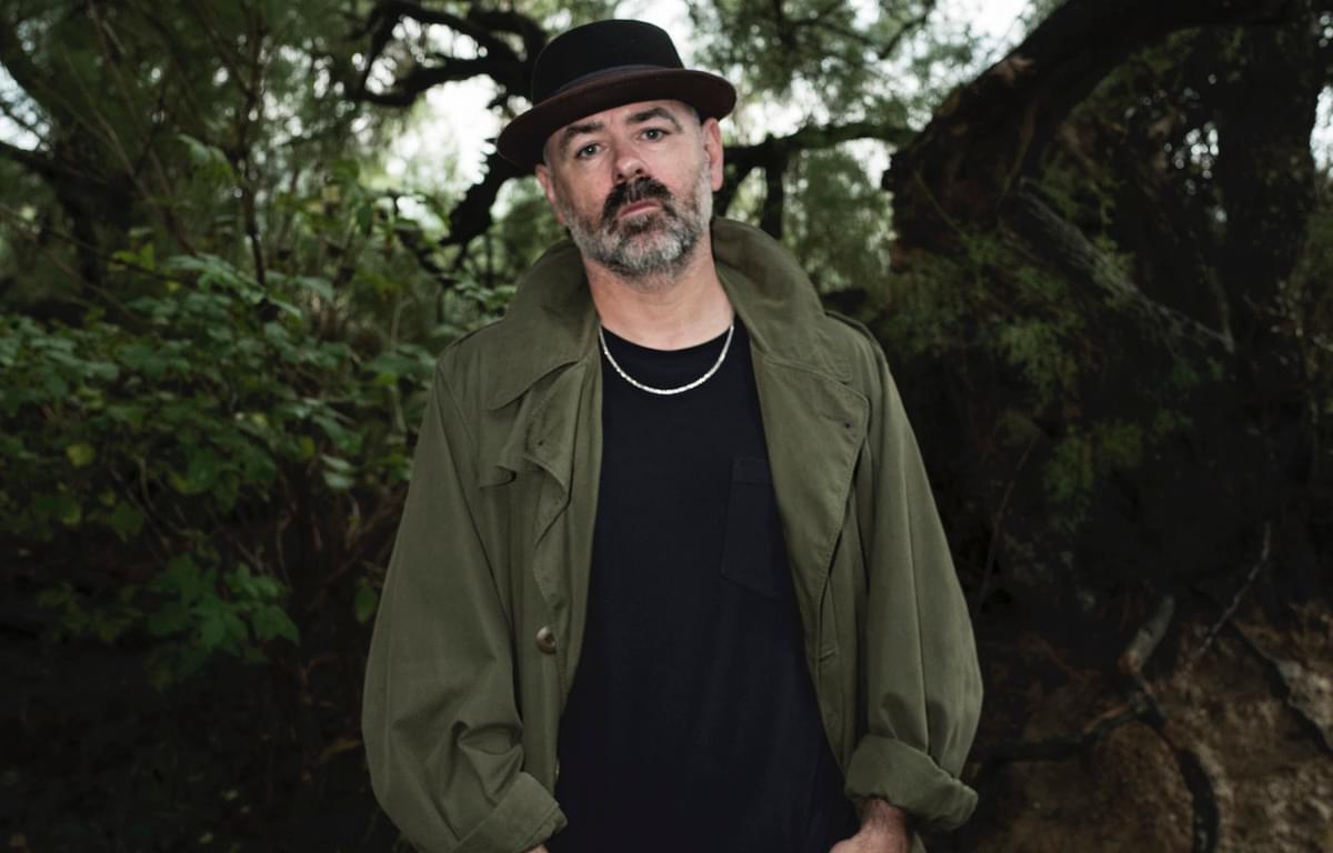 Steve Mason in front of tree green jacket hat