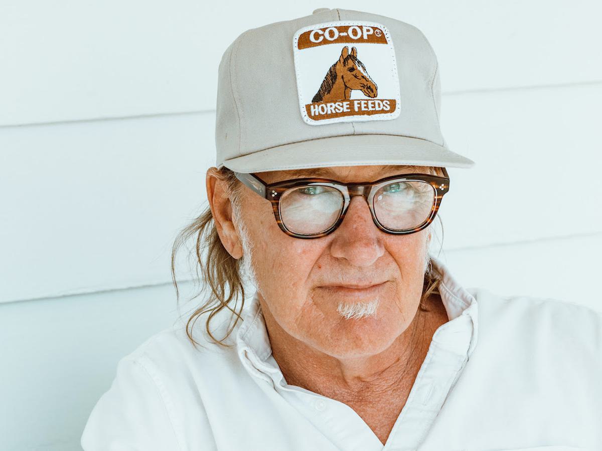 Lambchop's Kurt Wagner in a trucker cap against a white backdrop